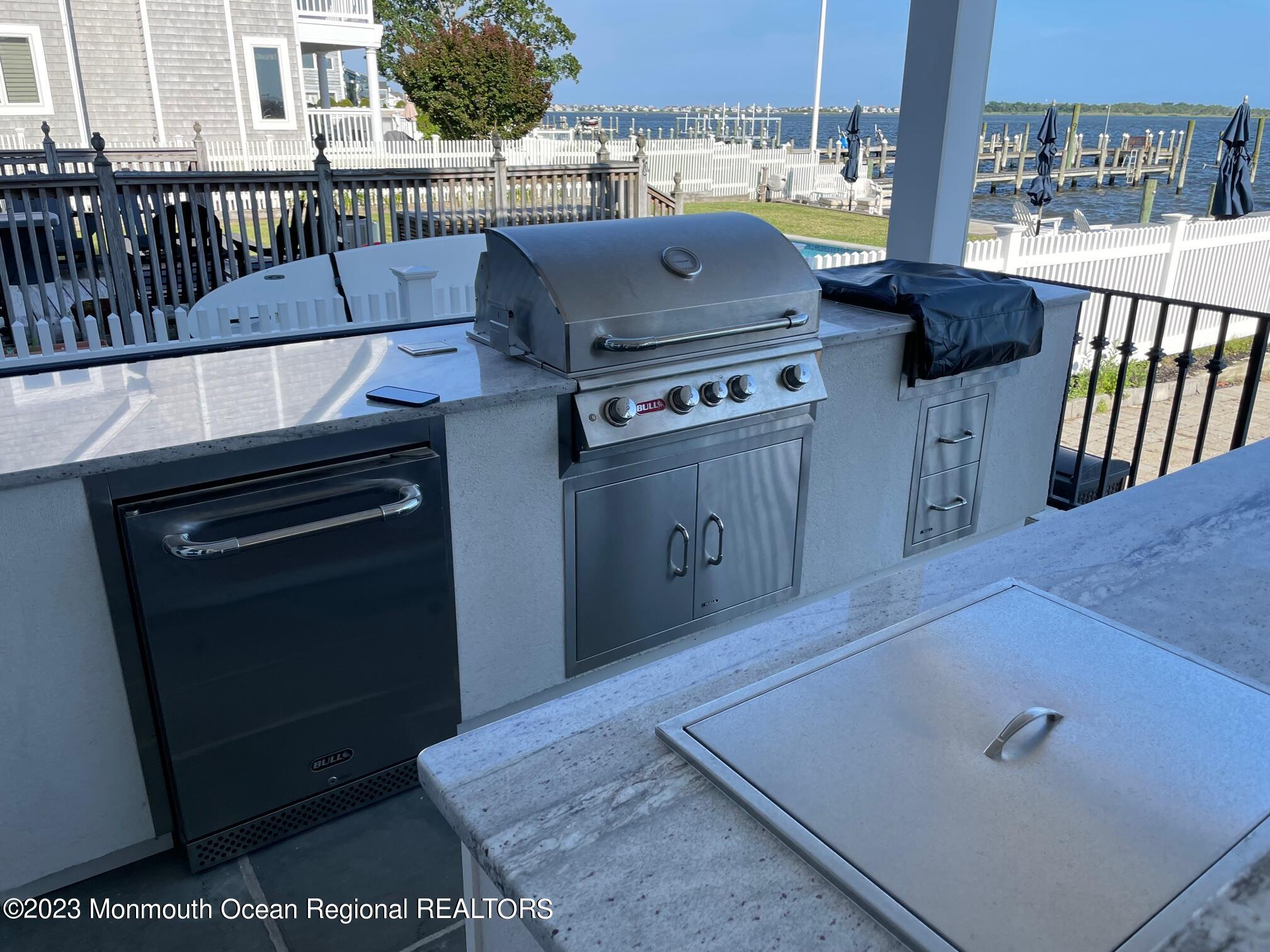 709 Princeton Avenue Brick, NJ 08724 - Photo 13 of 52 a kitchen with a stove and a microwave