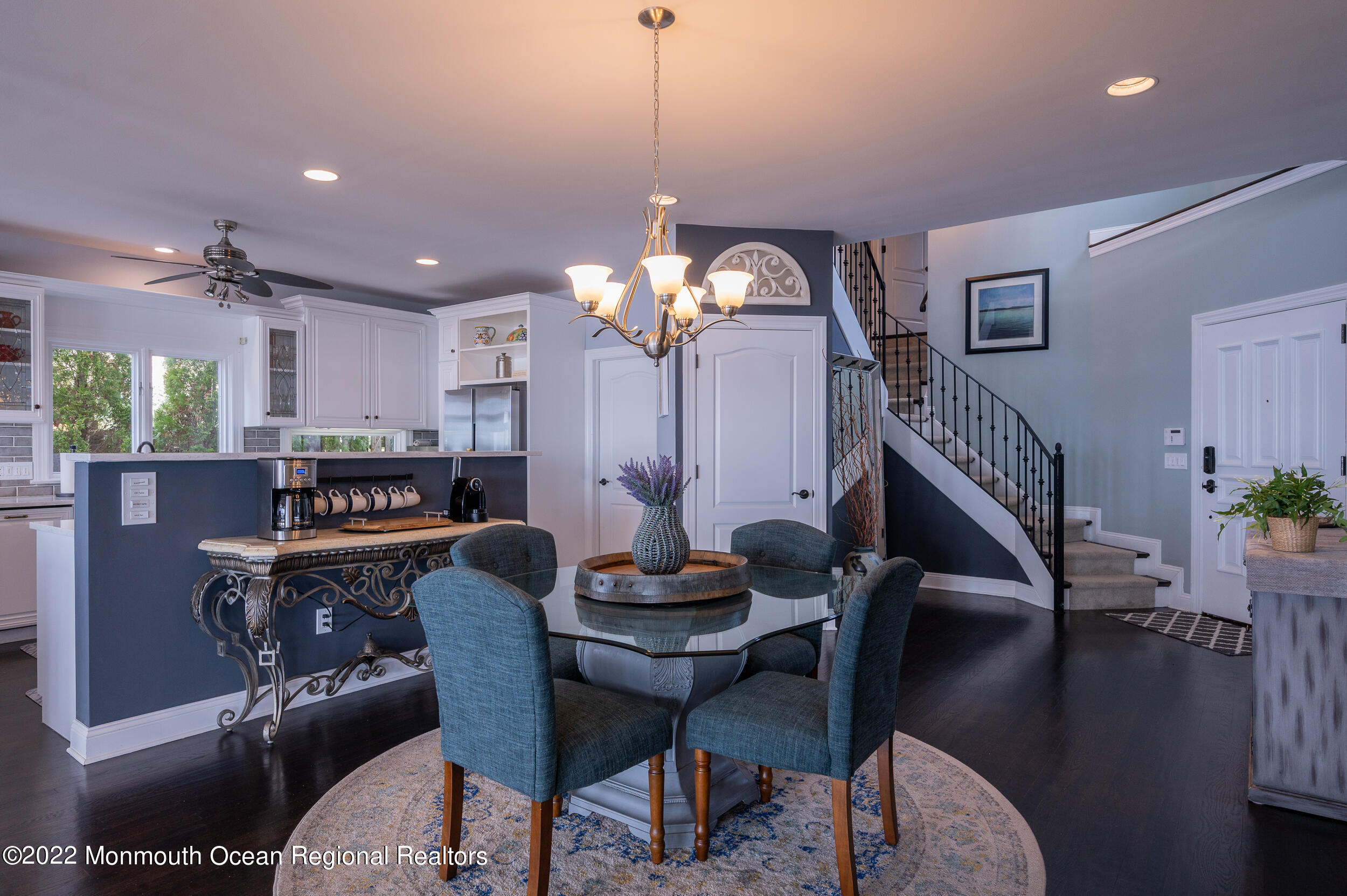 709 Princeton Avenue Brick, NJ 08724 - Photo 17 of 52 a dining room with furniture and a chandelier