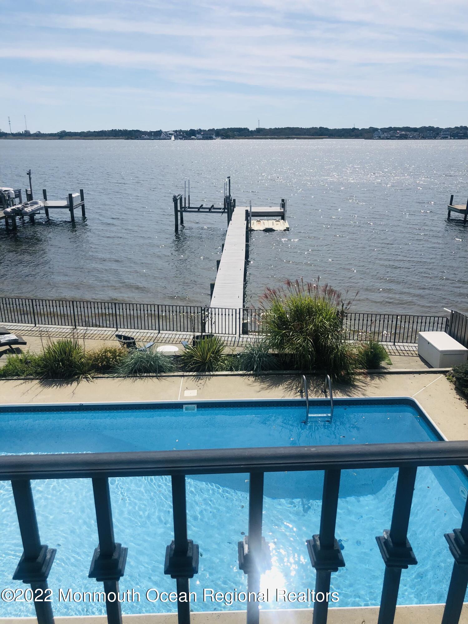 709 Princeton Avenue Brick, NJ 08724 - Photo 22 of 52 a view of a lake with couches in wooden floor
