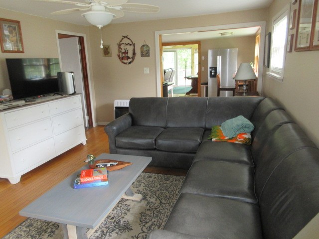 90 Riverside Lane Irvine, PA 16329 - Photo 8 of 47 Full sized sectional in the lviingn room with hardwood flooring