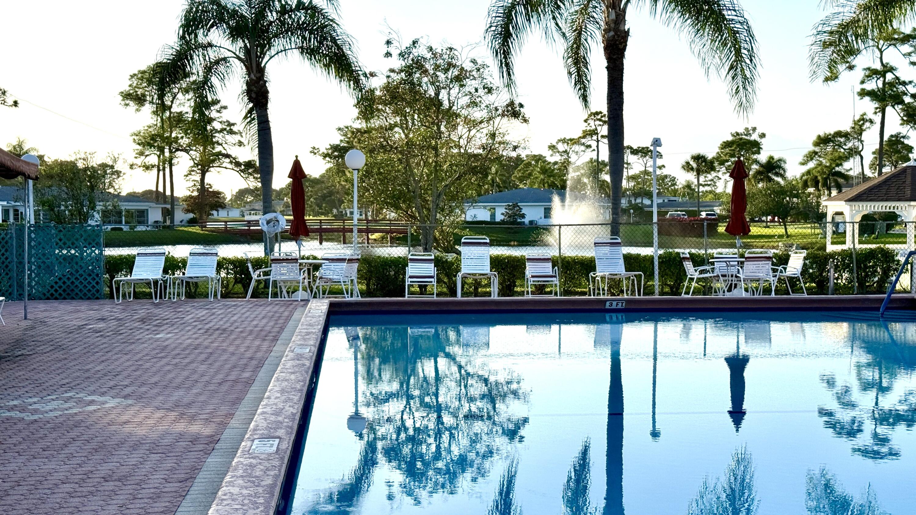 5242 Privet Place Delray Beach, FL 33484 - Photo 42 of 50 Clubhouse Pool + Lake