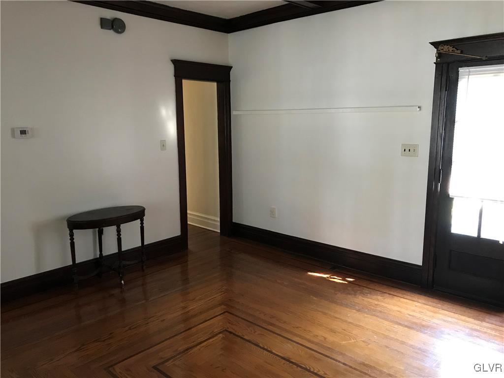 2122 Walnut Street Allentown, PA 18104 - Photo 16 of 31 a view of an empty room with wooden floor and a window