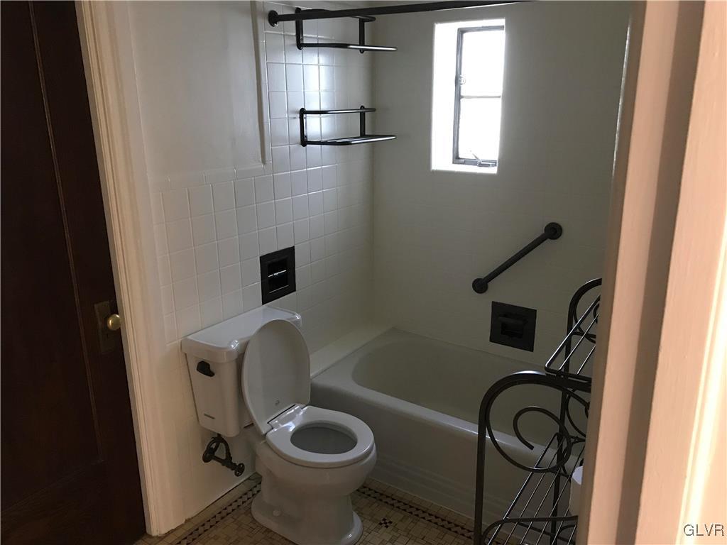 2122 Walnut Street Allentown, PA 18104 - Photo 20 of 31 a bathroom with a toilet sink and mirror