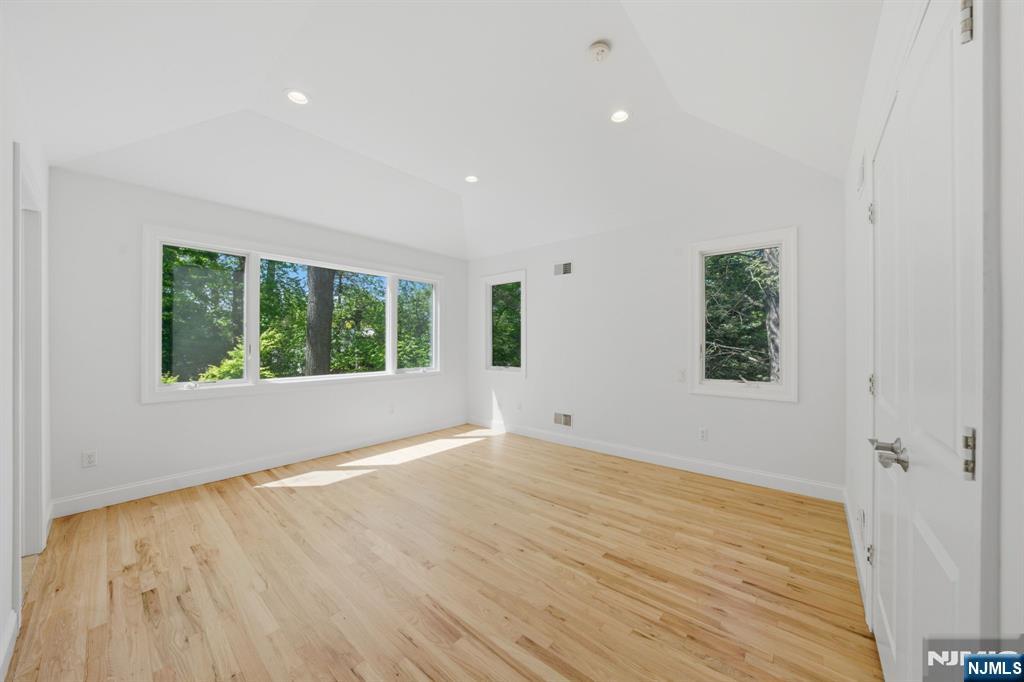 232 Riveredge Road Tenafly, NJ 07670 - Photo 25 of 50 wooden floor in an empty room with a window