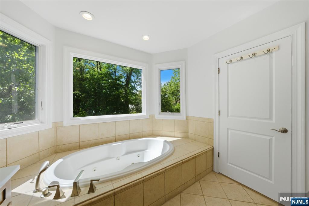 232 Riveredge Road Tenafly, NJ 07670 - Photo 29 of 50 a bathroom with a tub and a sink