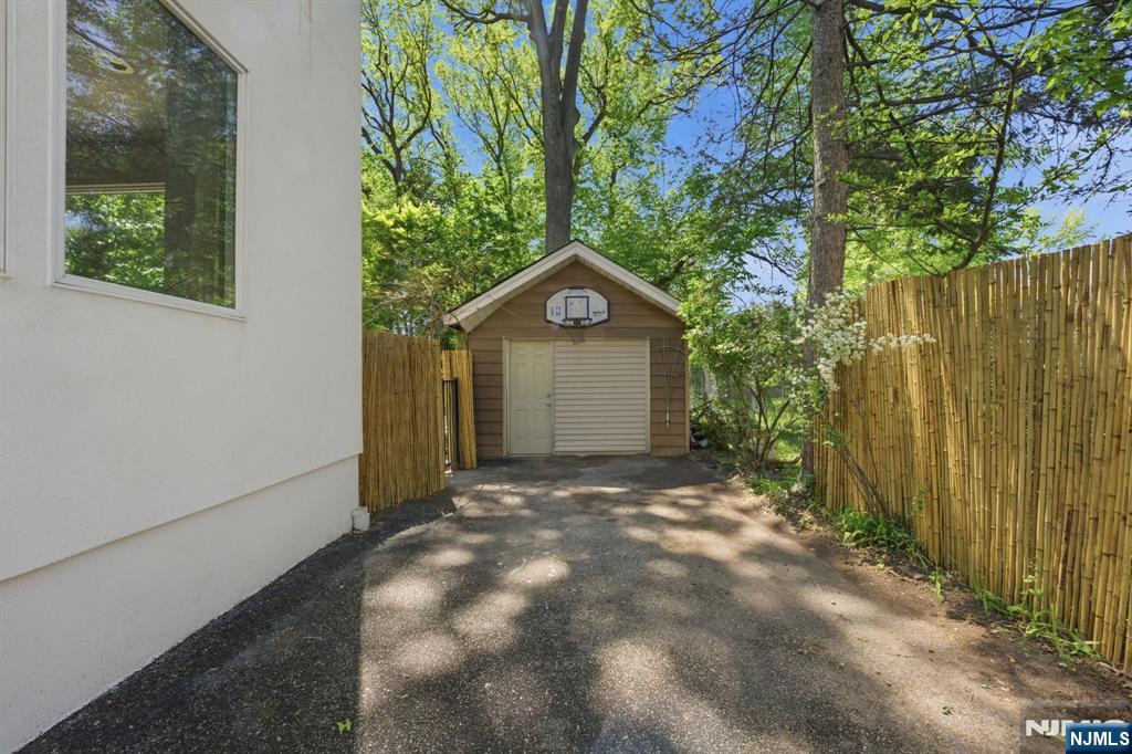 232 Riveredge Road Tenafly, NJ 07670 - Photo 4 of 50 a view of a house with a yard and large tree