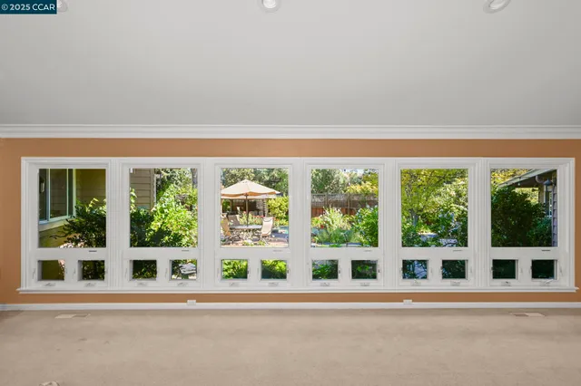 a bathroom with a granite countertop sink a large mirror and a bathtub