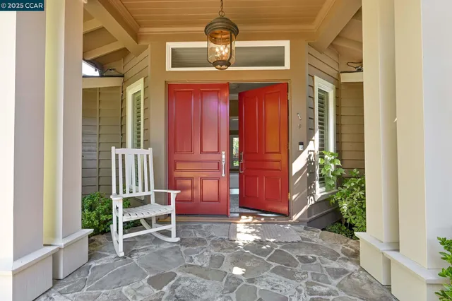 a large white kitchen with a large window