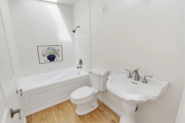 a bathroom with a sink toilet and bathtub