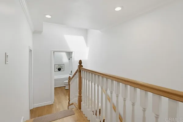 a view of staircase with white walls