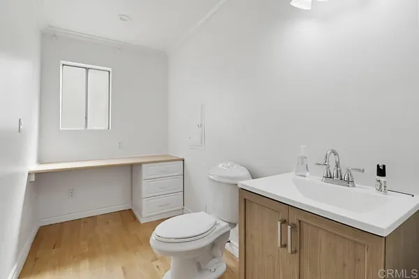 a bathroom with a sink toilet and vanity