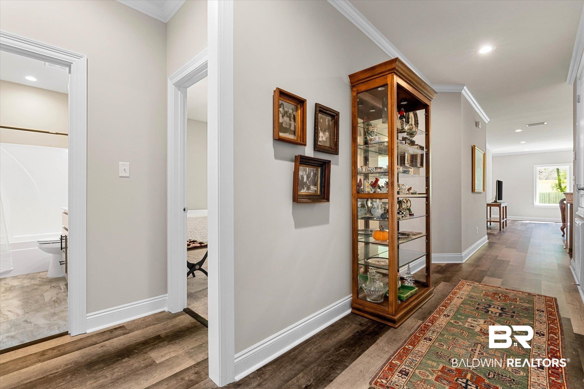 1101 Pinemont Drive Mobile, AL 36609 - Photo 2 of 18 Hall featuring baseboards, ornamental molding, wood finished floors, and recessed lighting