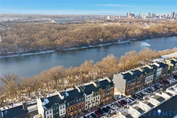 an aerial view of residential building with outdoor space and lake view