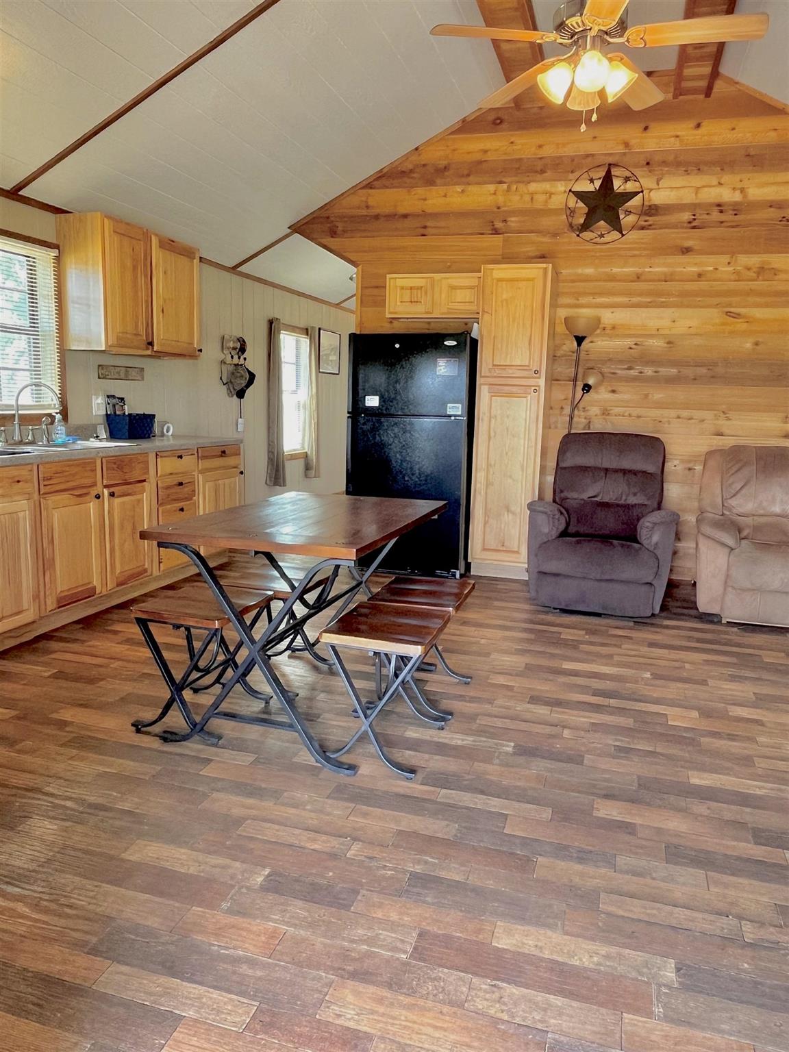 175 Elmer Road Llano, TX 78643 - Photo 11 of 25 a living room with furniture and a flat screen tv