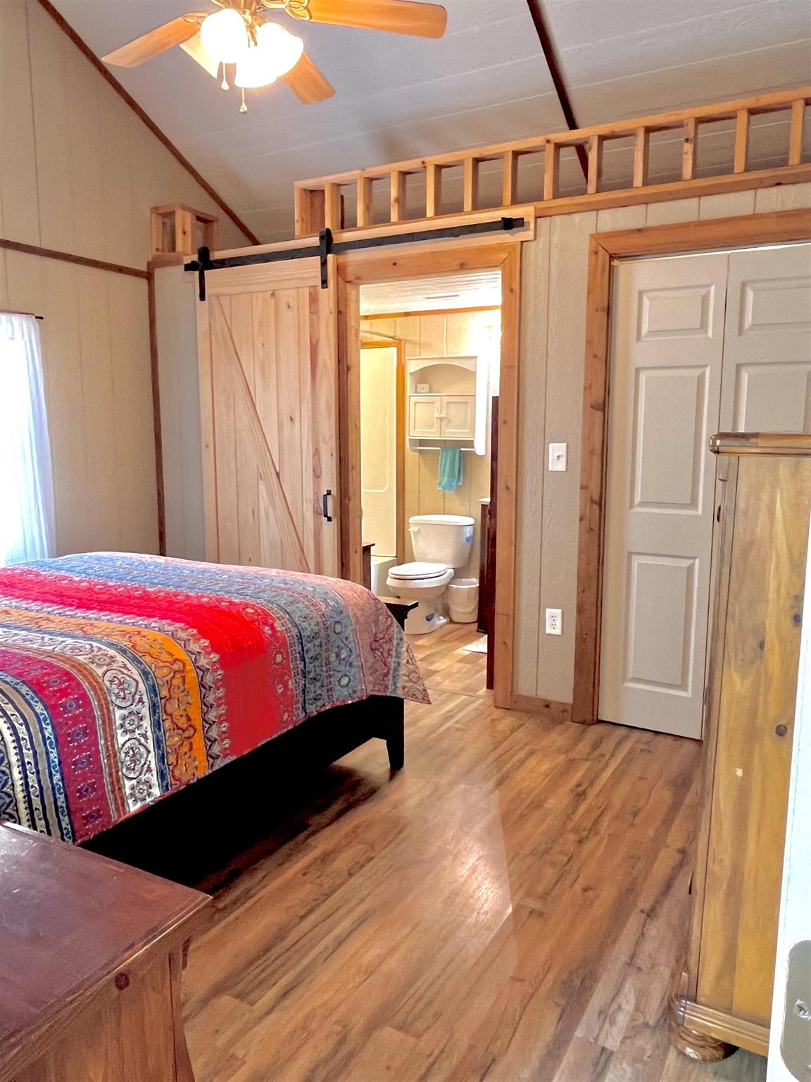 175 Elmer Road Llano, TX 78643 - Photo 13 of 25 a bedroom with a bed and a mirror