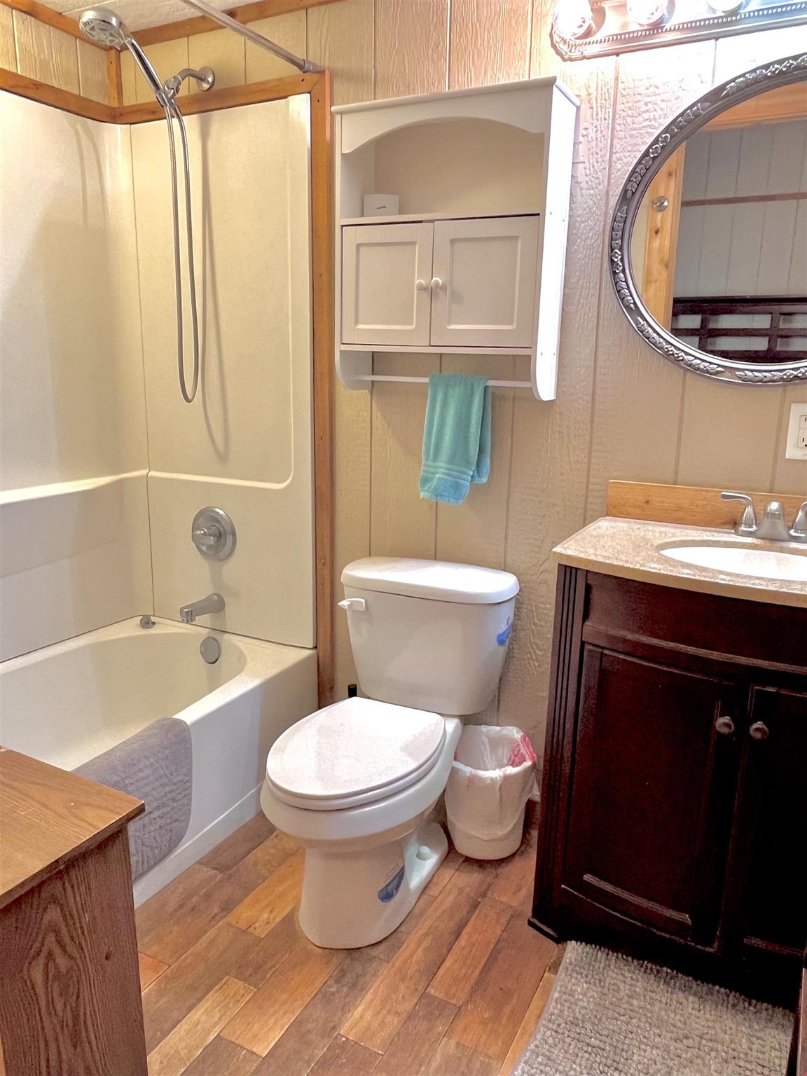 175 Elmer Road Llano, TX 78643 - Photo 14 of 25 a bathroom with a sink toilet and shower