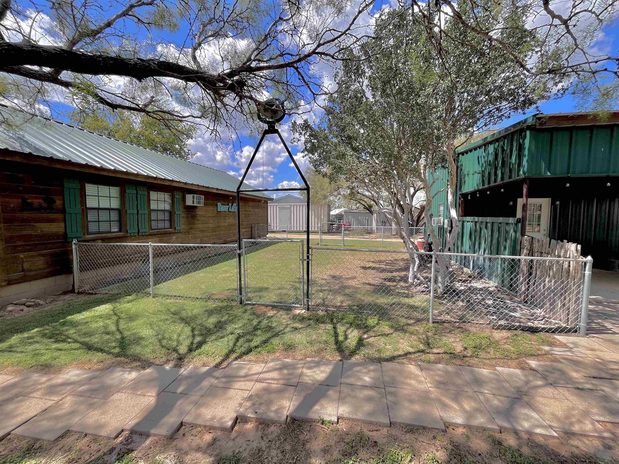 175 Elmer Road Llano, TX 78643 - Photo 18 of 25 a view of a house with backyard and sitting area