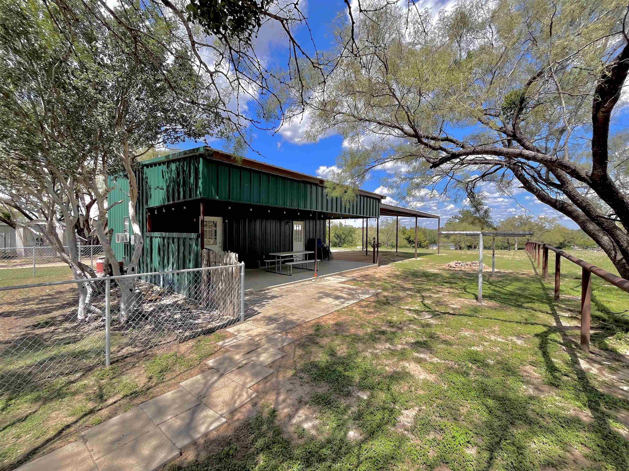 175 Elmer Road Llano, TX 78643 - Photo 7 of 25 a view of a house with a yard