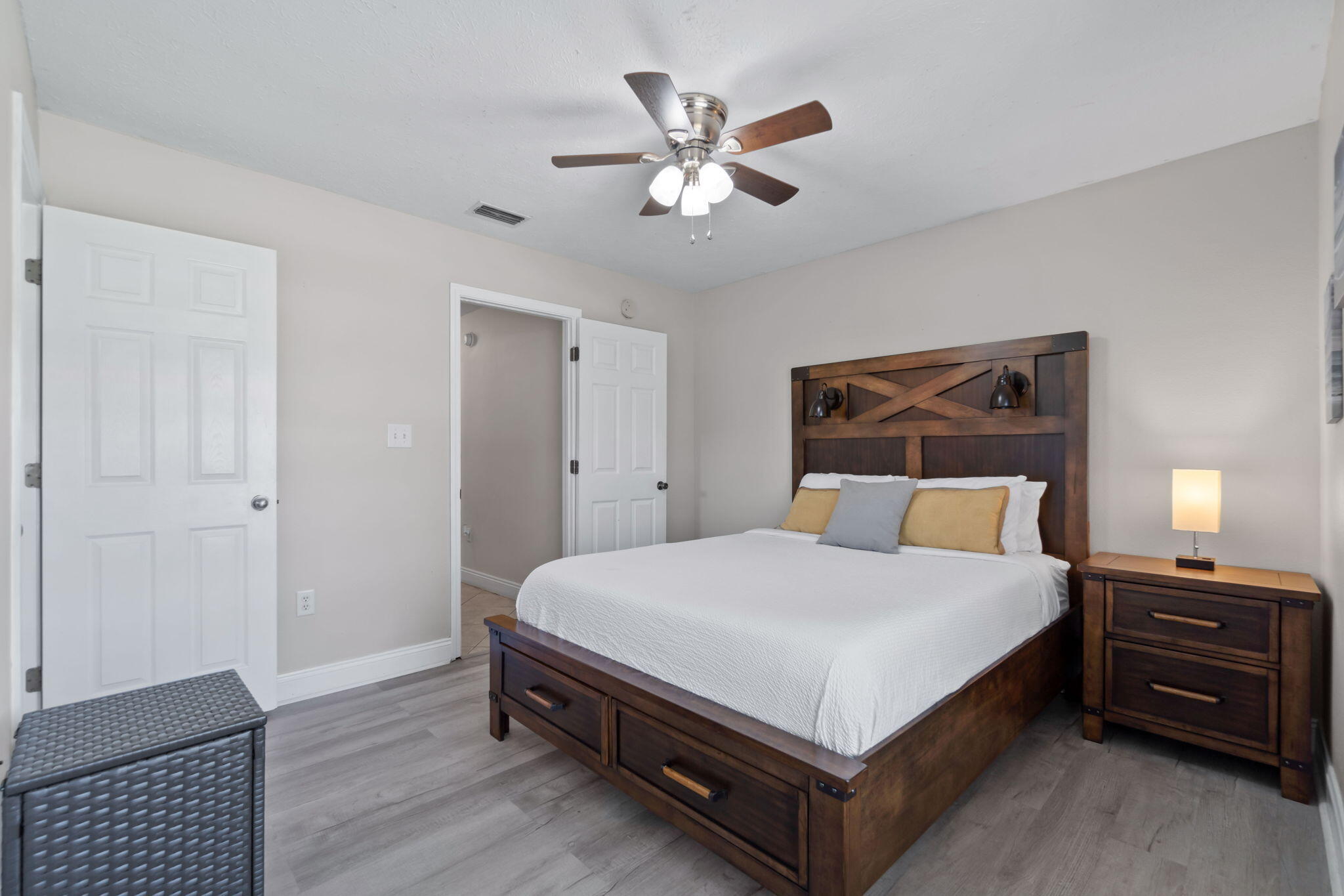 6983 Snug Waters Road Navarre, FL 32566 - Photo 28 of 48 a bedroom with a bed and a ceiling fan