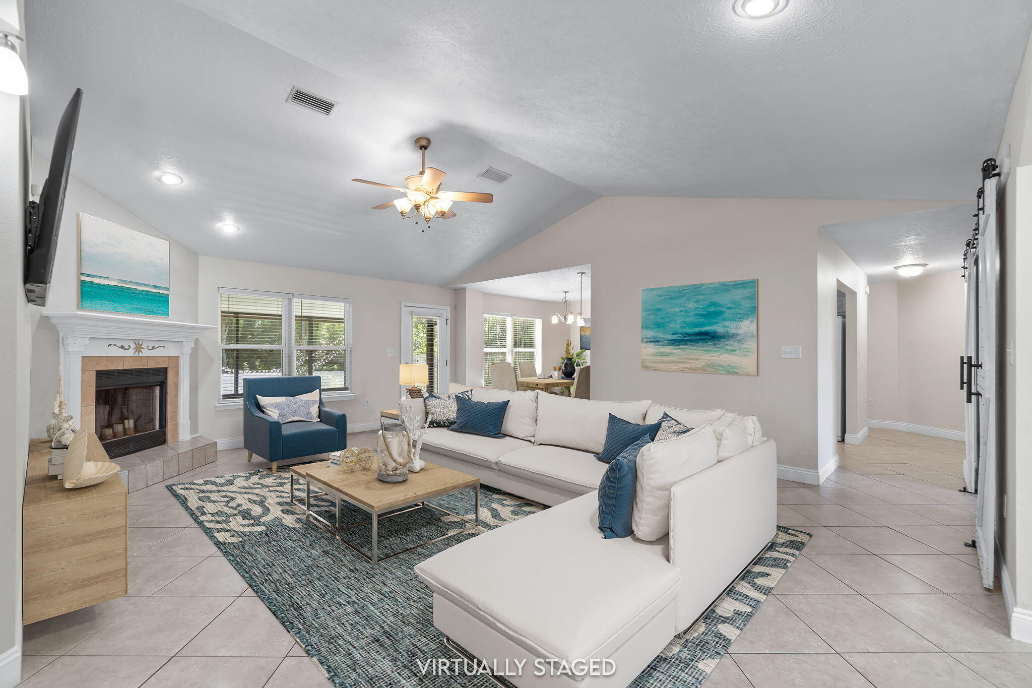 6983 Snug Waters Road Navarre, FL 32566 - Photo 7 of 48 a living room with furniture fireplace and a large window