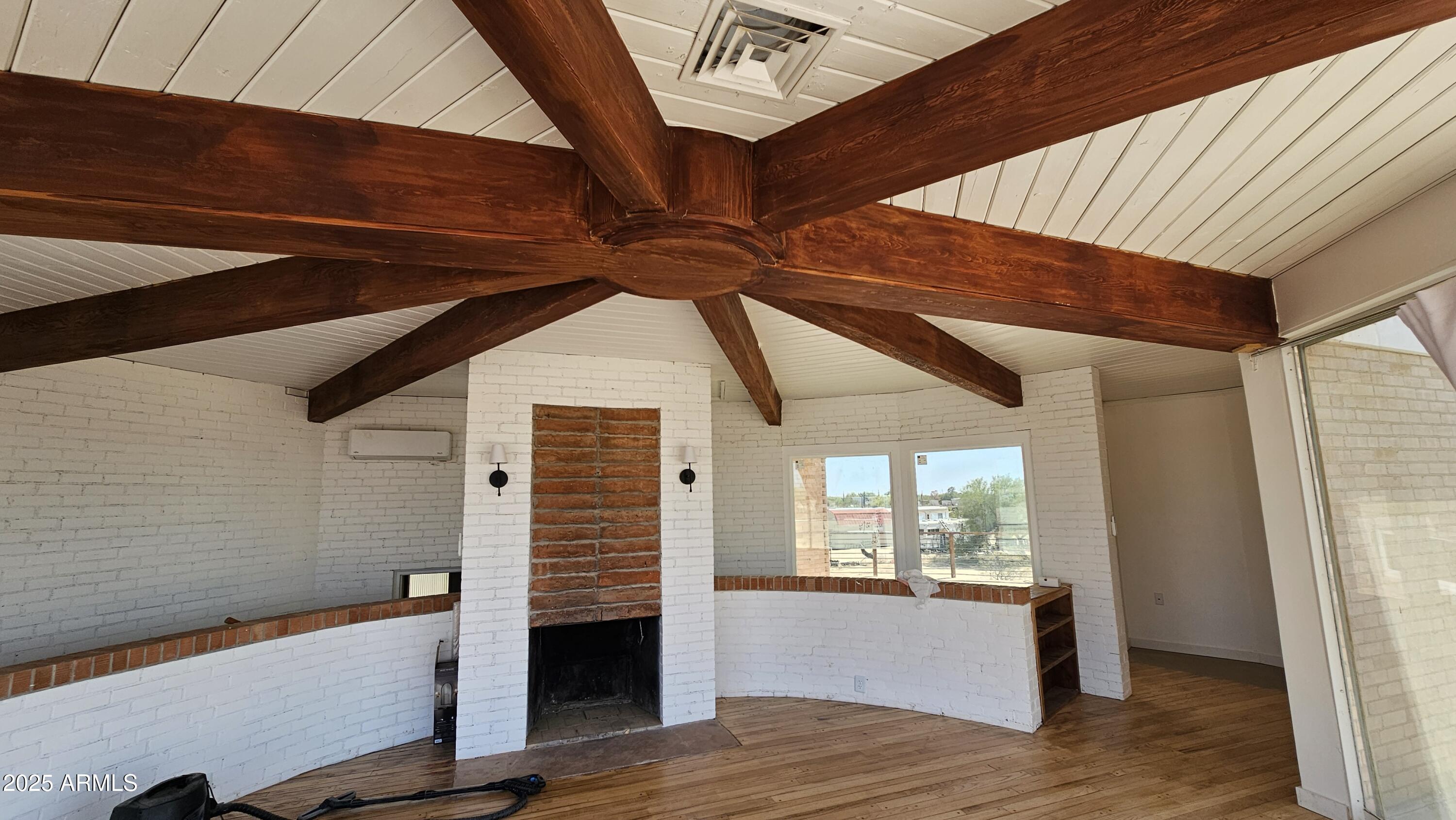 9220 North Diffin Road Florence, AZ 85132 - Photo 3 of 9 a view of room with window and wooden floor