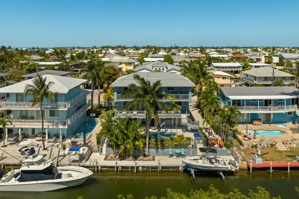 an aerial view of ocean residential house with outdoor space and trees