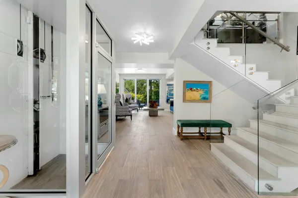a view of a livingroom with furniture and hardwood floor