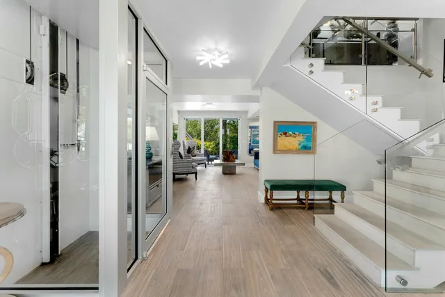 a view of a livingroom with furniture and hardwood floor