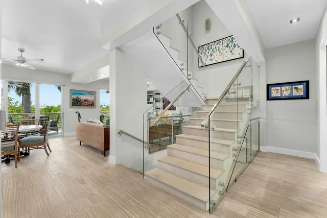 a bedroom with two beds and a window