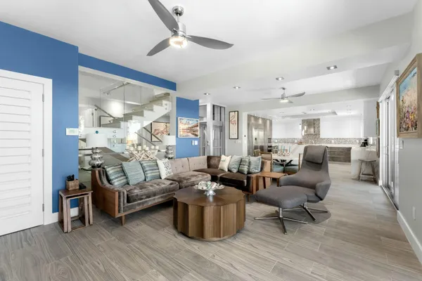 an aerial view of a house with outdoor space lake view and trees all around