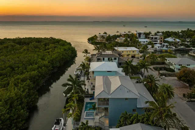 a view of a chairs and table in a patio