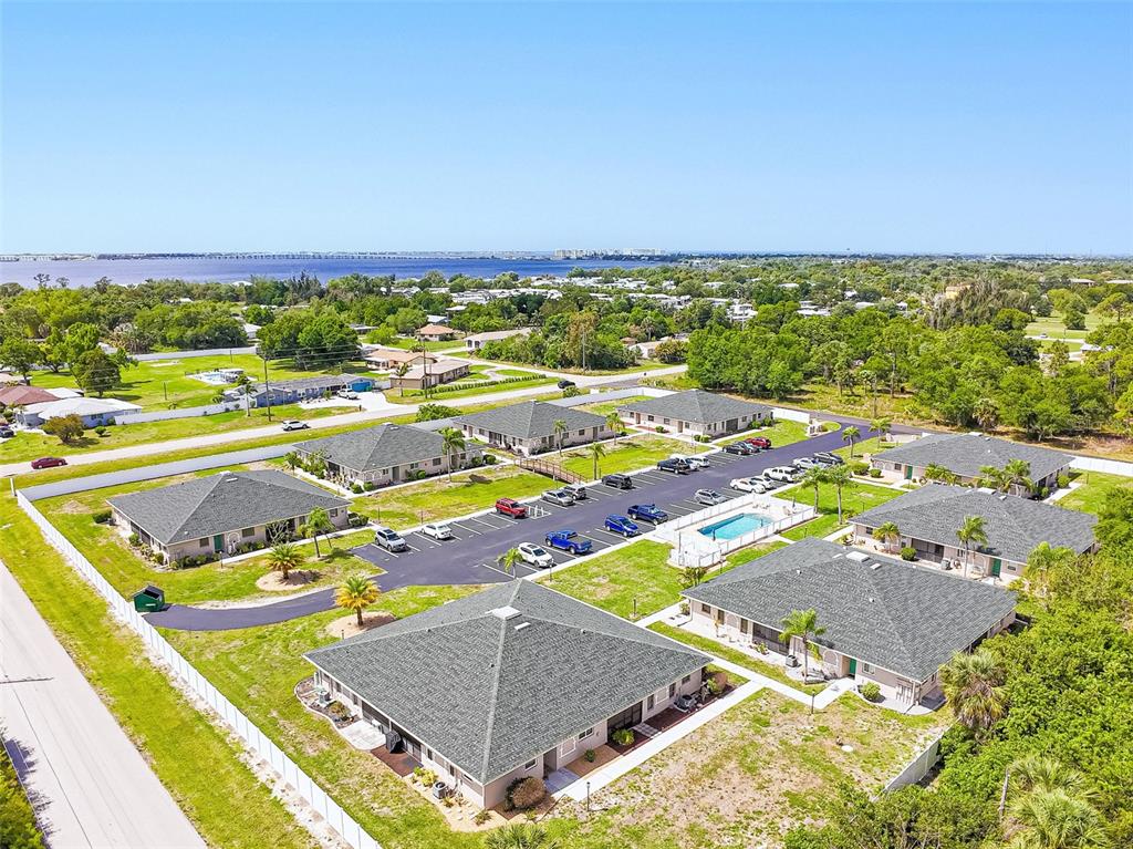 24540 Harbor View Road, Unit D3 Punta Gorda, FL 33980 - Photo 31 of 33 an aerial view of residential houses with outdoor space