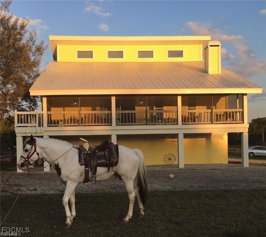 11751 Shawnee Road Fort Myers, FL 33913 - Photo 1 of 32 a front view of a house with swimming pool