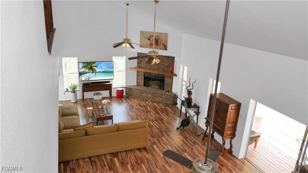 11751 Shawnee Road Fort Myers, FL 33913 - Photo 15 of 32 a living room with furniture and a fireplace