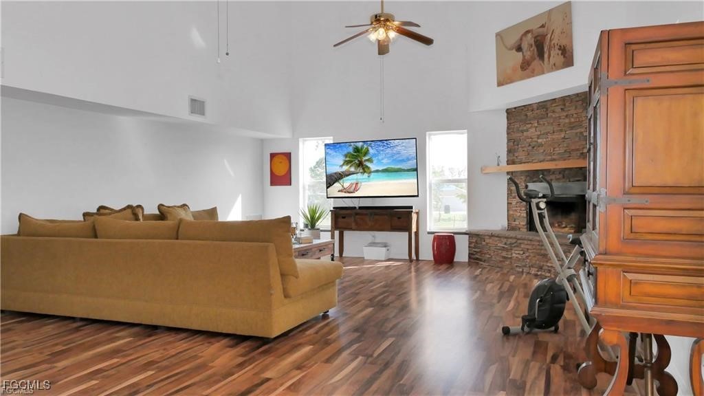 11751 Shawnee Road Fort Myers, FL 33913 - Photo 20 of 32 a living room with furniture and a fireplace