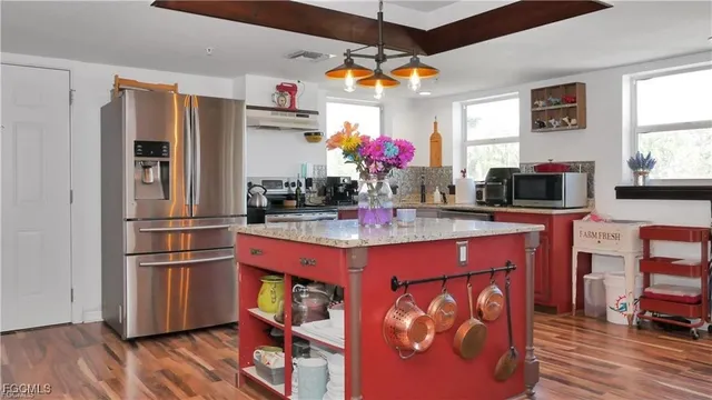 a view of a kitchen and dining area