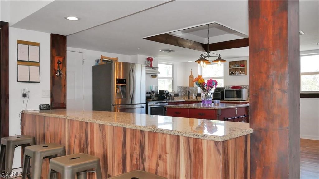 11751 Shawnee Road Fort Myers, FL 33913 - Photo 23 of 32 a view of a kitchen and dining area