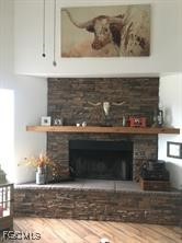 11751 Shawnee Road Fort Myers, FL 33913 - Photo 31 of 32 a view of fireplace and wooden floor
