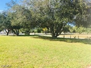 11751 Shawnee Road Fort Myers, FL 33913 - Photo 32 of 32 a view of swimming pool with an outdoor space and seating area