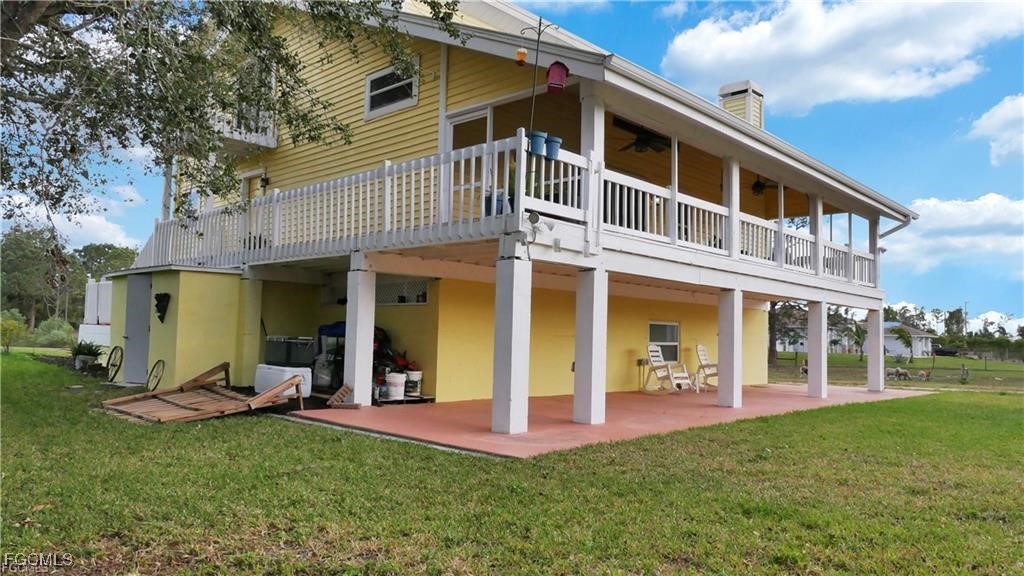 11751 Shawnee Road Fort Myers, FL 33913 - Photo 6 of 32 a view of a house with a yard porch and sitting area