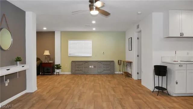 a bedroom with a bed and cupboard