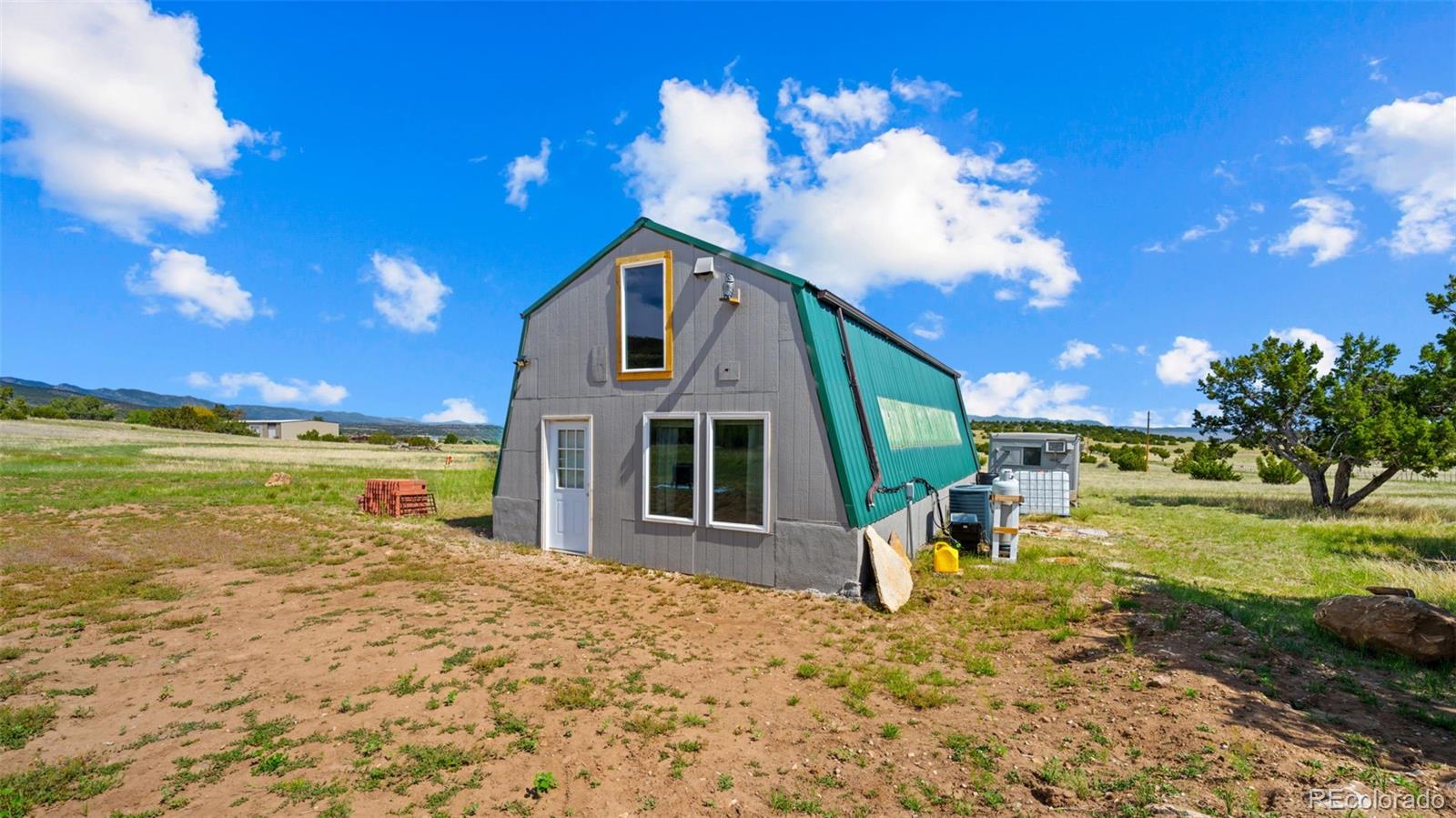 2904 Siloam Road Pueblo, CO 81005 - Photo 23 of 34 a view of a house with a yard