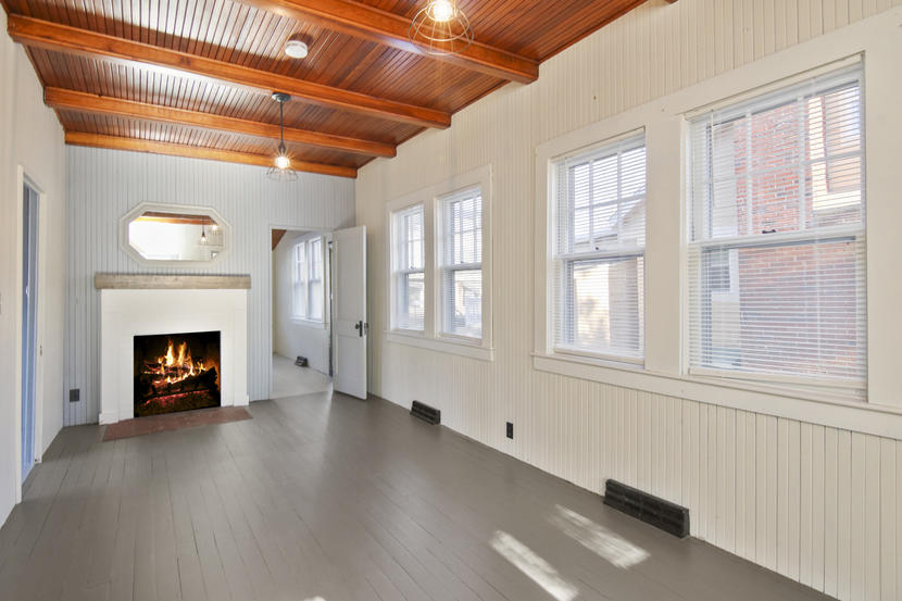 3 Ash Street Wareham, MA 02571 - Photo 4 of 22 an empty room with wooden floor fireplace and windows