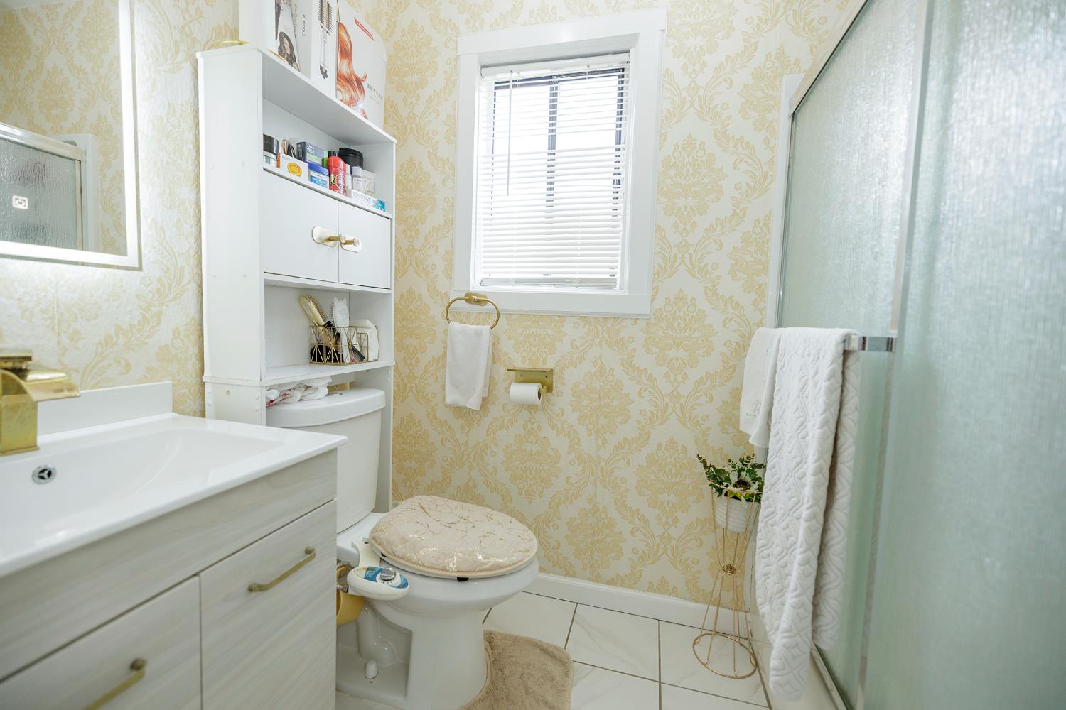 421 East 8th Street Stockton, CA 95206 - Photo 15 of 20 a bathroom with a sink toilet and shower