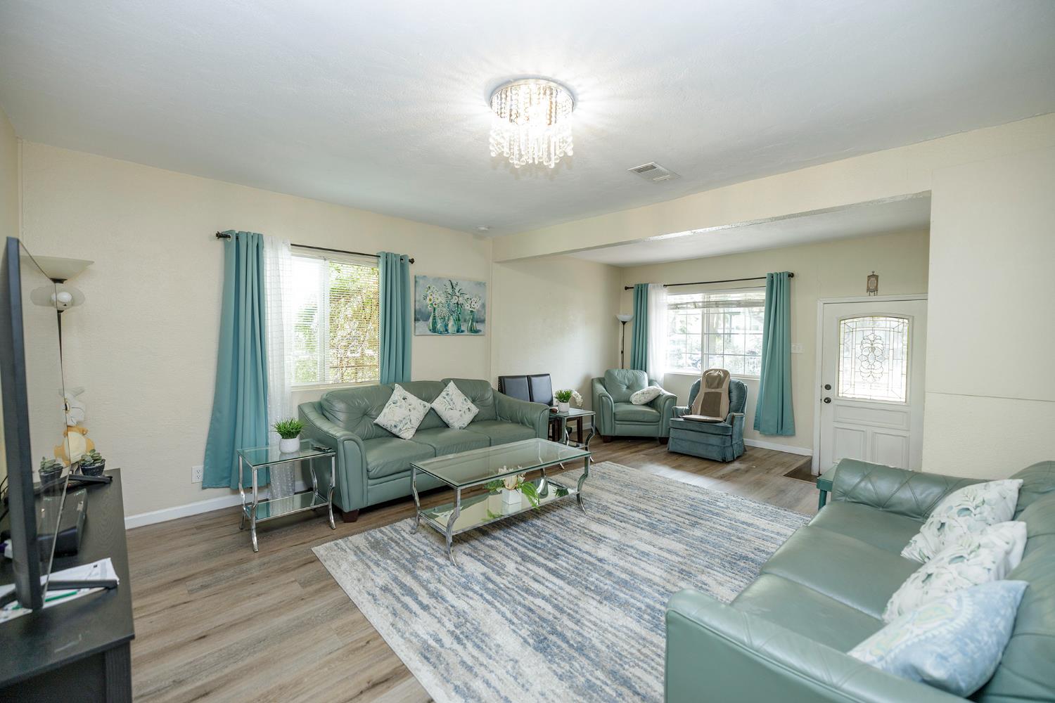 421 East 8th Street Stockton, CA 95206 - Photo 5 of 20 a living room with furniture and a wooden floor
