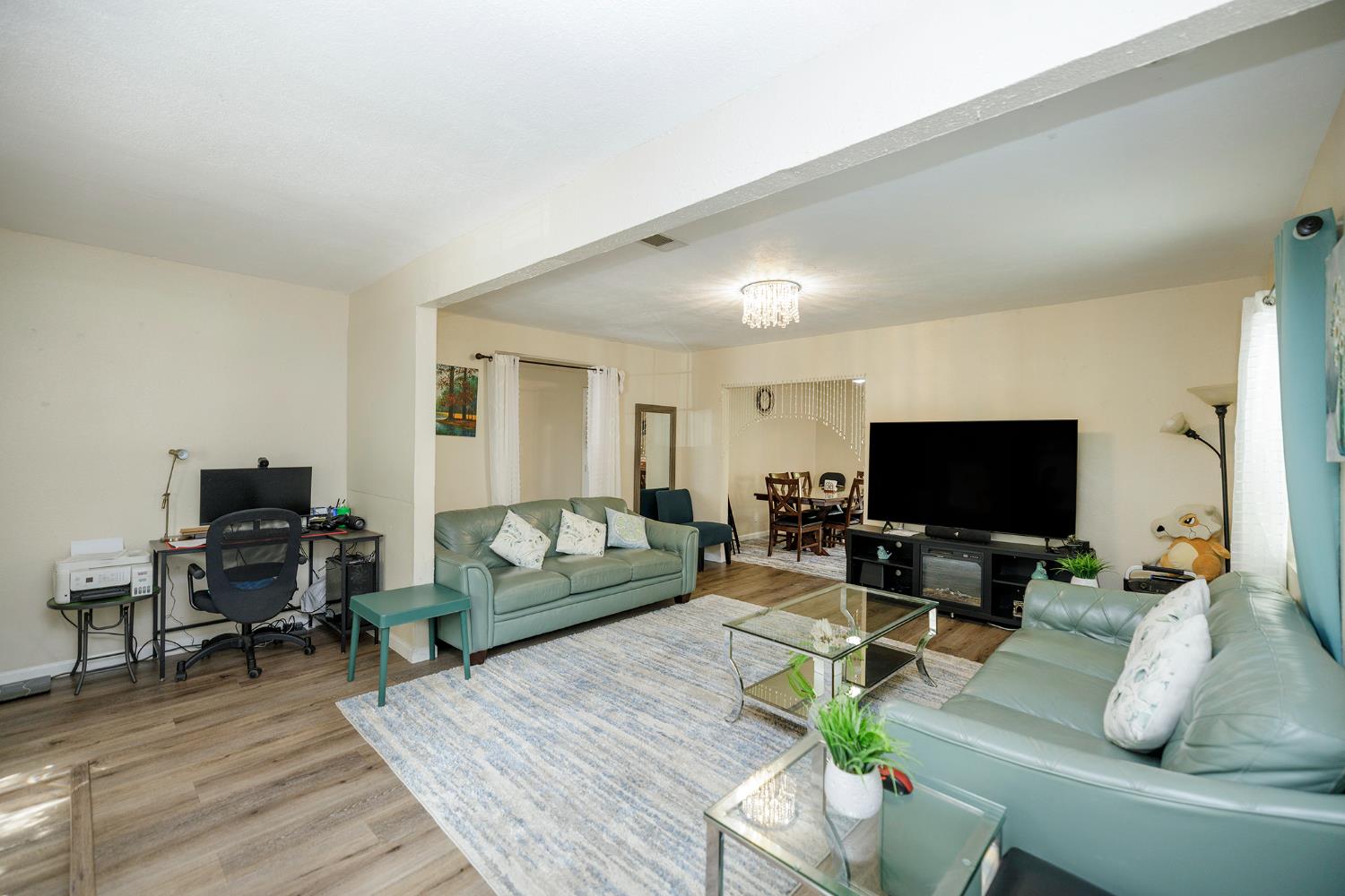 421 East 8th Street Stockton, CA 95206 - Photo 8 of 20 a living room with furniture and a flat screen tv