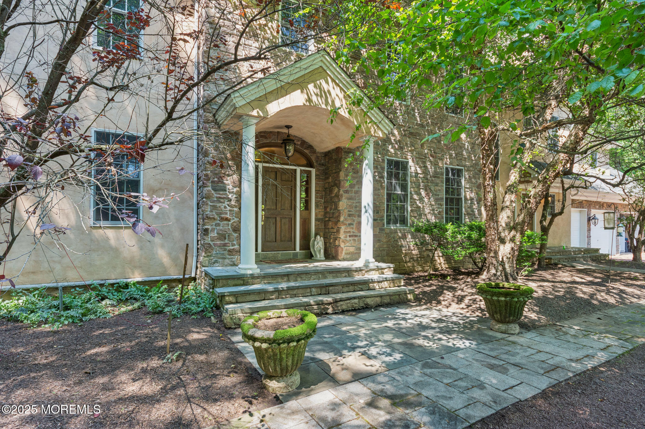 a front view of a house with garden