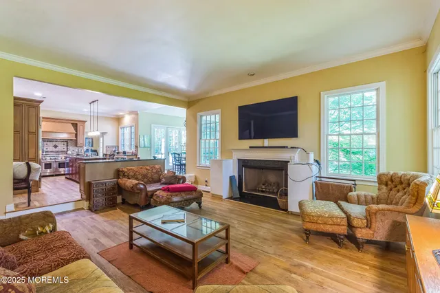 a living room with furniture fireplace and a flat screen tv