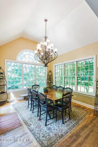 a view of a dining room with furniture window and outside view