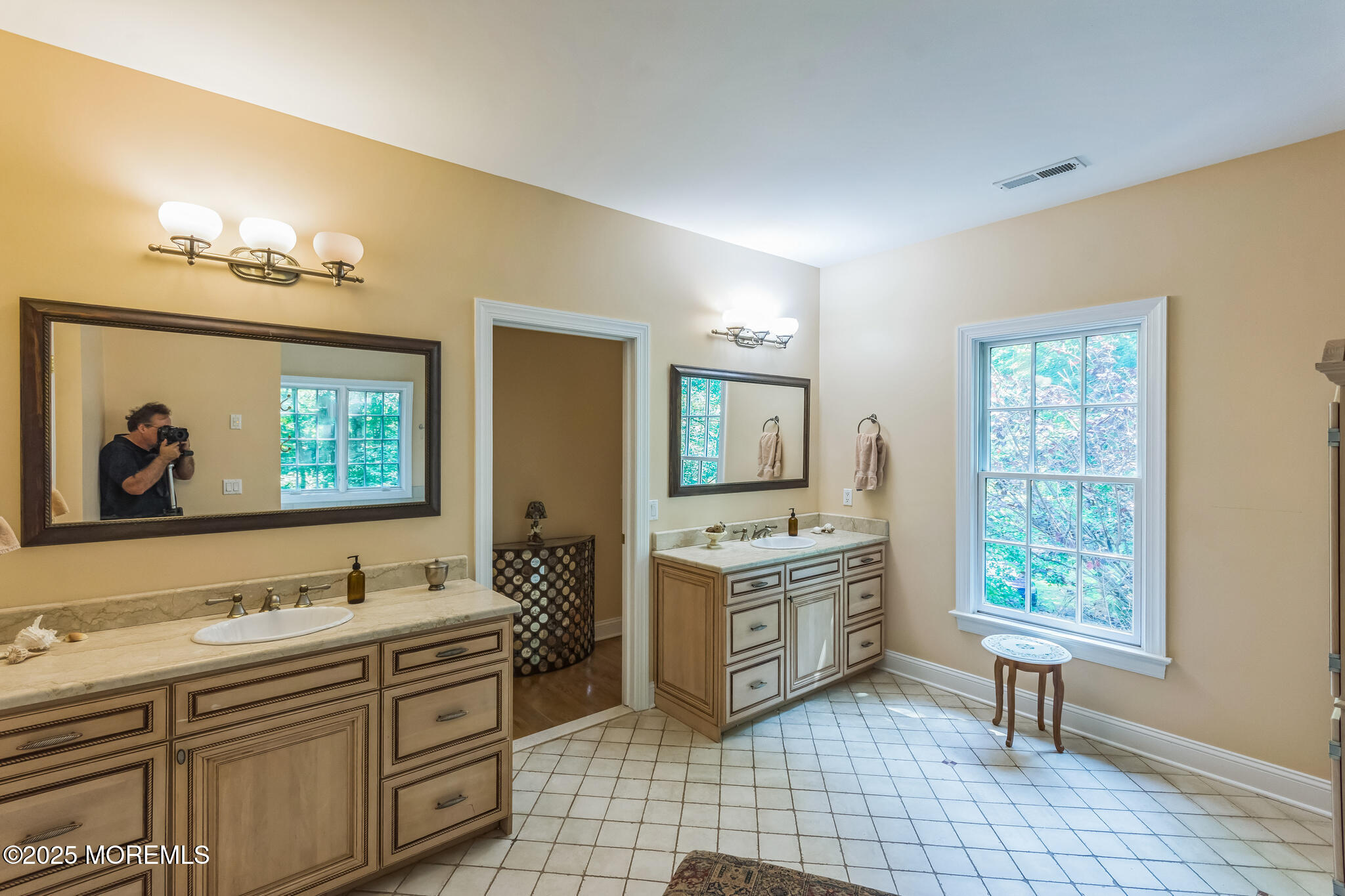 458 Cherry Hill Road Princeton, NJ 08540 - Photo 45 of 50 a spacious bathroom with a double vanity sink a two mirror a window and a bathtub
